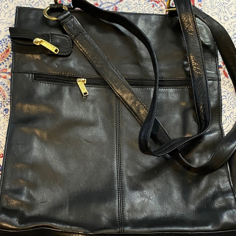 Elegant black leather tote with divider for computer or notebook. Unisex